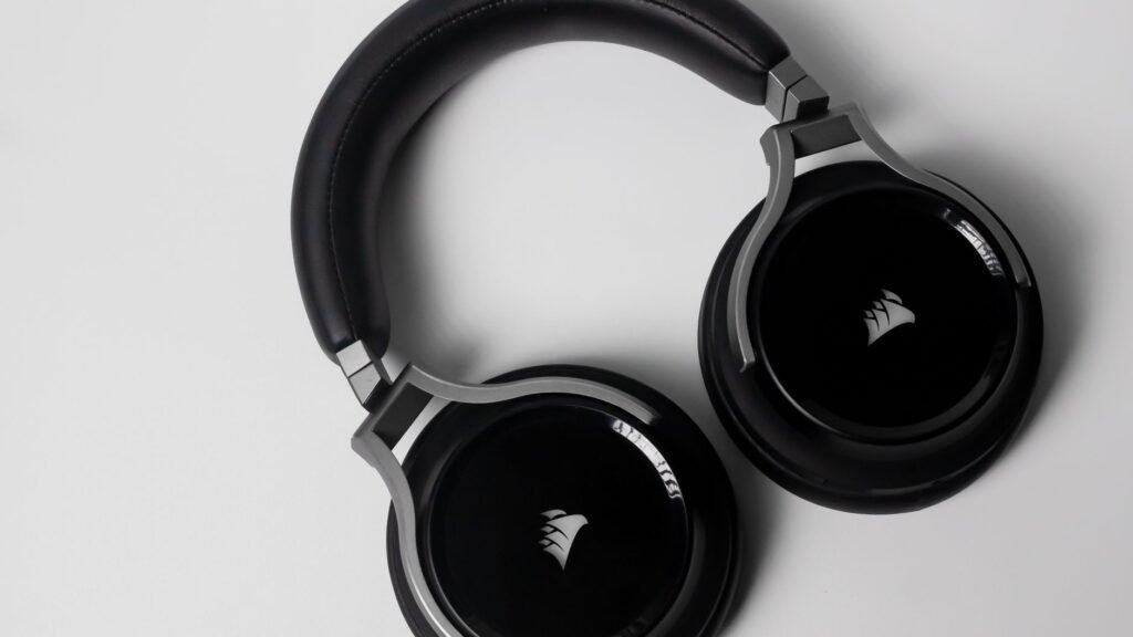 Stylish black over-ear wireless headphones on a clean white background.