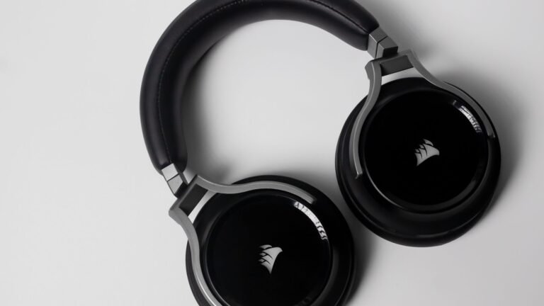 Stylish black over-ear wireless headphones on a clean white background.