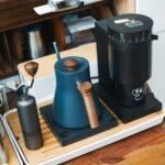 Stylish coffee grinder and kettle setup, perfect for a contemporary home barista.