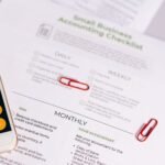 Image of a checklist and calculator for managing small business accounting tasks efficiently.