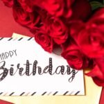 A stylish birthday card surrounded by vibrant red roses on a red background.