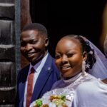 Happy couple celebrating their wedding day with smiles and love.