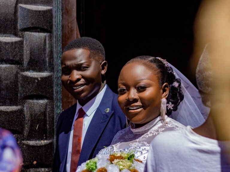 Happy couple celebrating their wedding day with smiles and love.