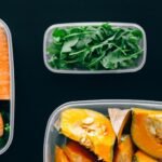 Healthy vegetables stored in plastic containers for fresh and nutritious meals.